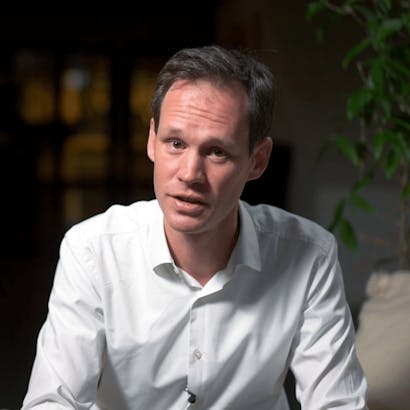 A man looking into the camera explaining