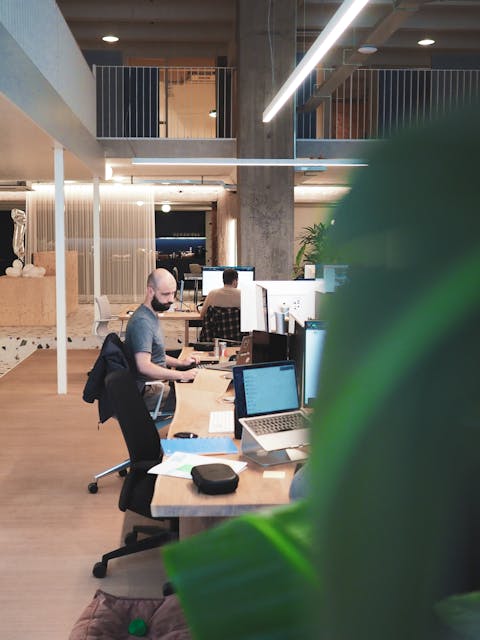 Office antwerp 2 Man working on computer sitting in Antwerp Craftzing office