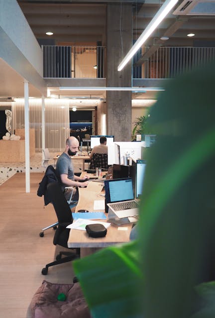Man working on computer sitting in Antwerp Craftzing office