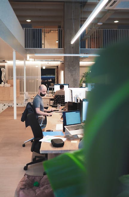 Man working on computer sitting in Antwerp Craftzing office
