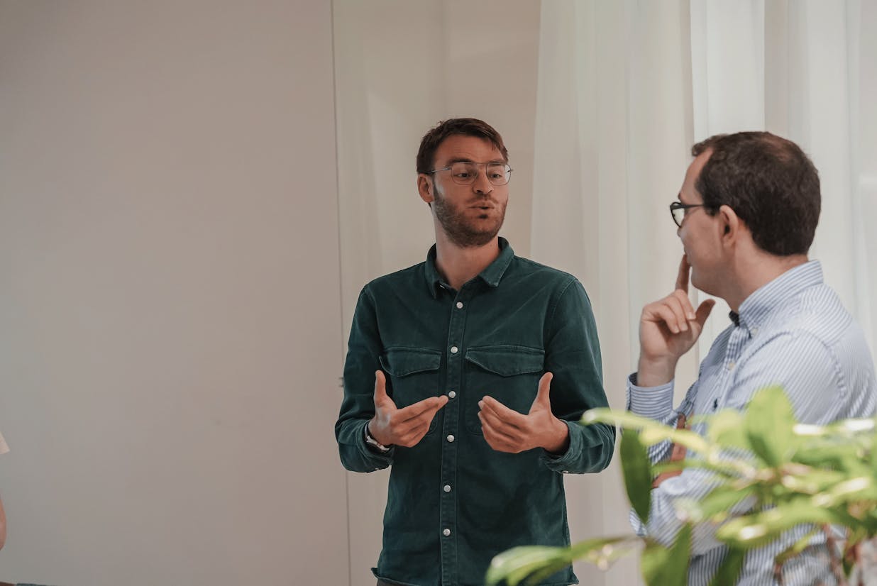 two men talking looking at each other
