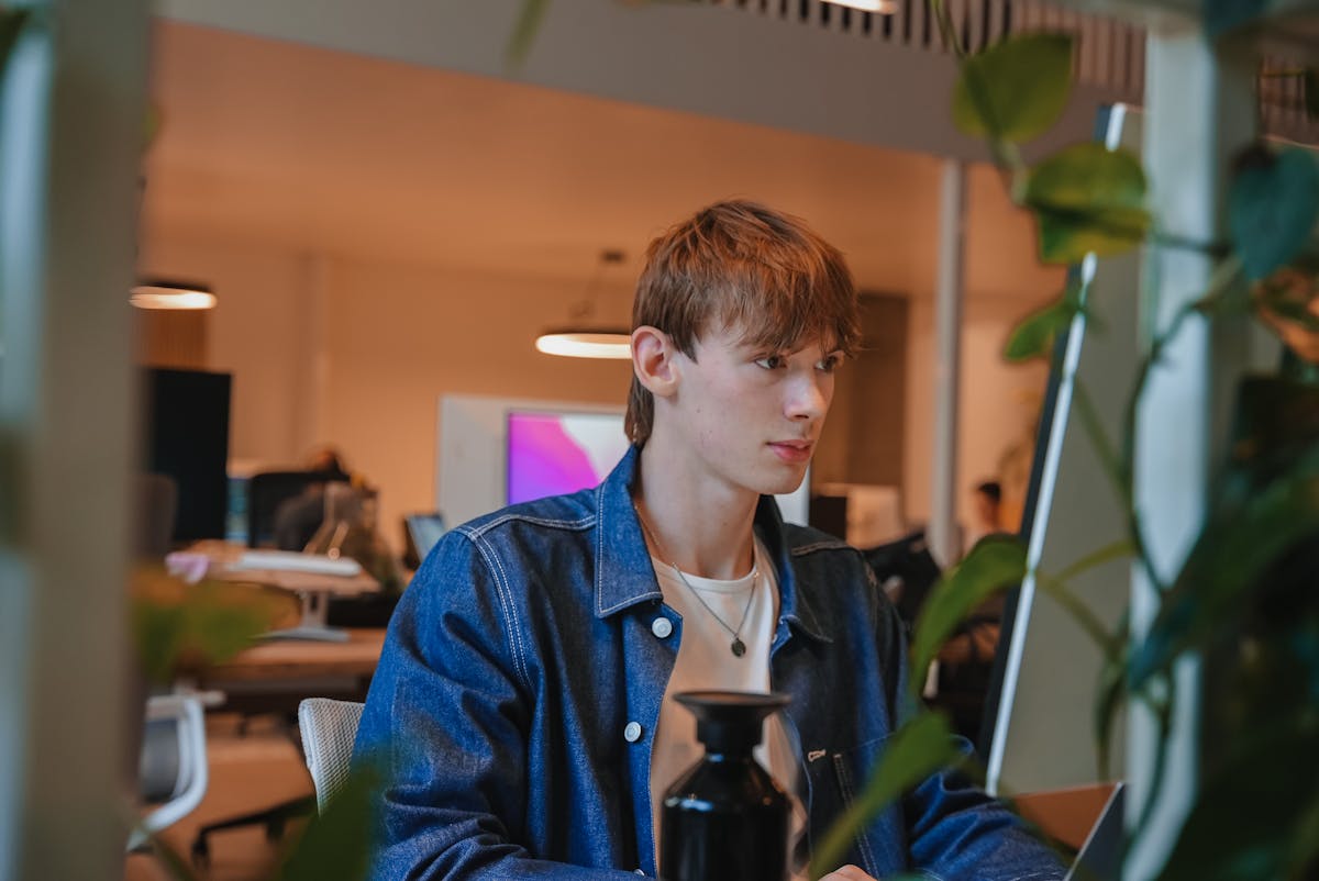 Previous intern Tommy working on his computer