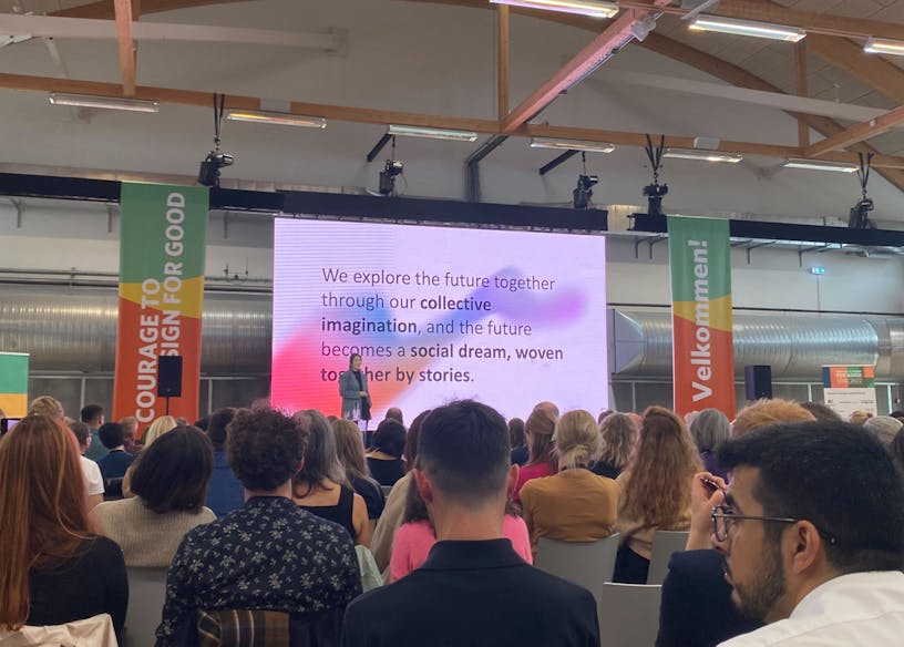 Group of people at Service Design Global Conference attending a presentation