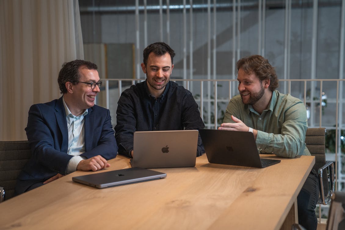 Craftzing's 3 bosses sitting together and smiling at a screen