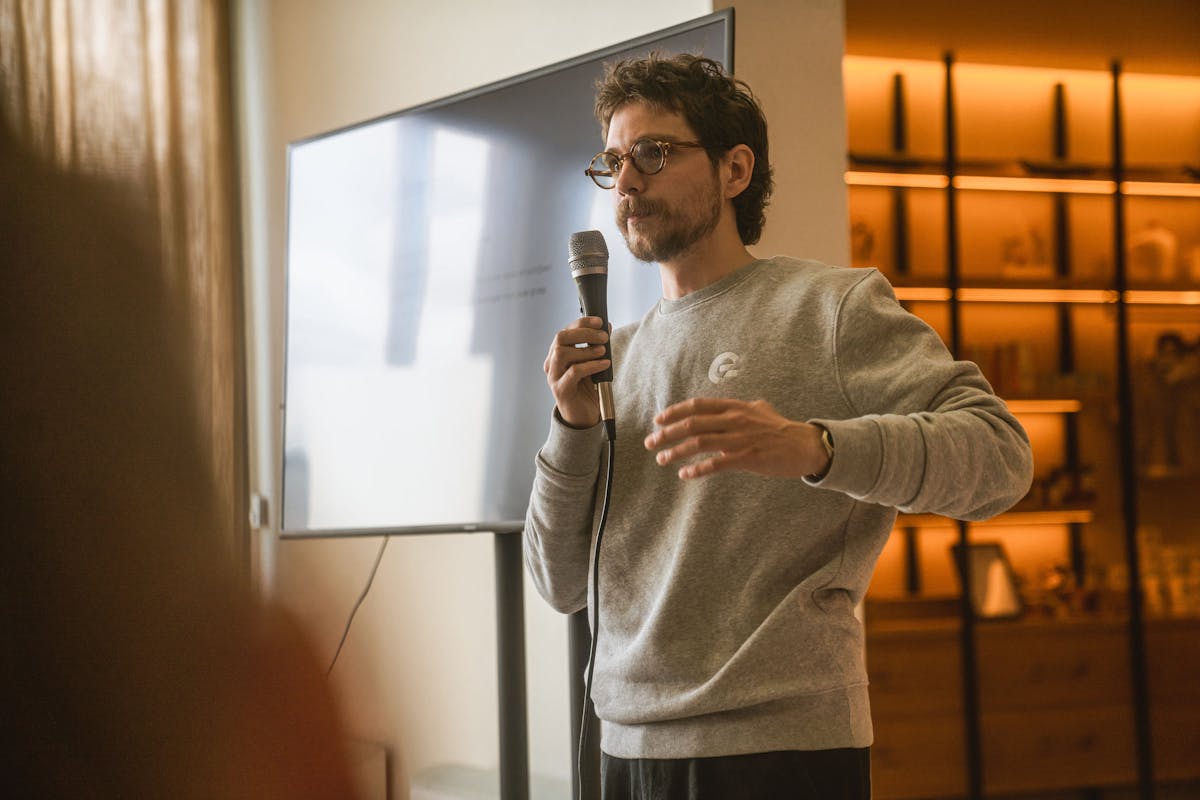 Wout holding a microphone during of his presentations