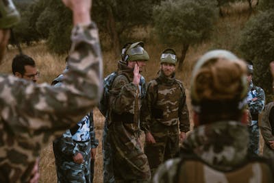 Group of 8 Craftzing colleagues playing paintball