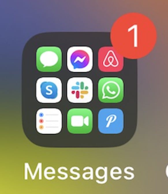 Screenshot of an iPhone folder with a reminder badge on the folder.