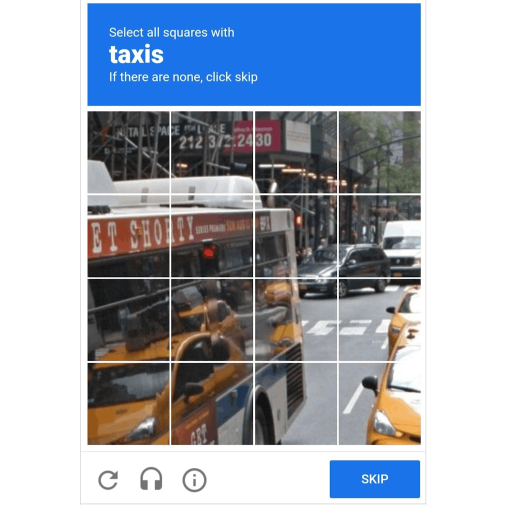 Example of a recaptcha showing busses, yellow cabs and cars in a busy street in an American city
