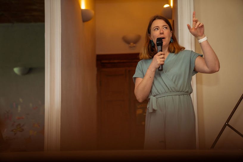 Business designer and head of talent Femke De Roo taking the word at a presentation.