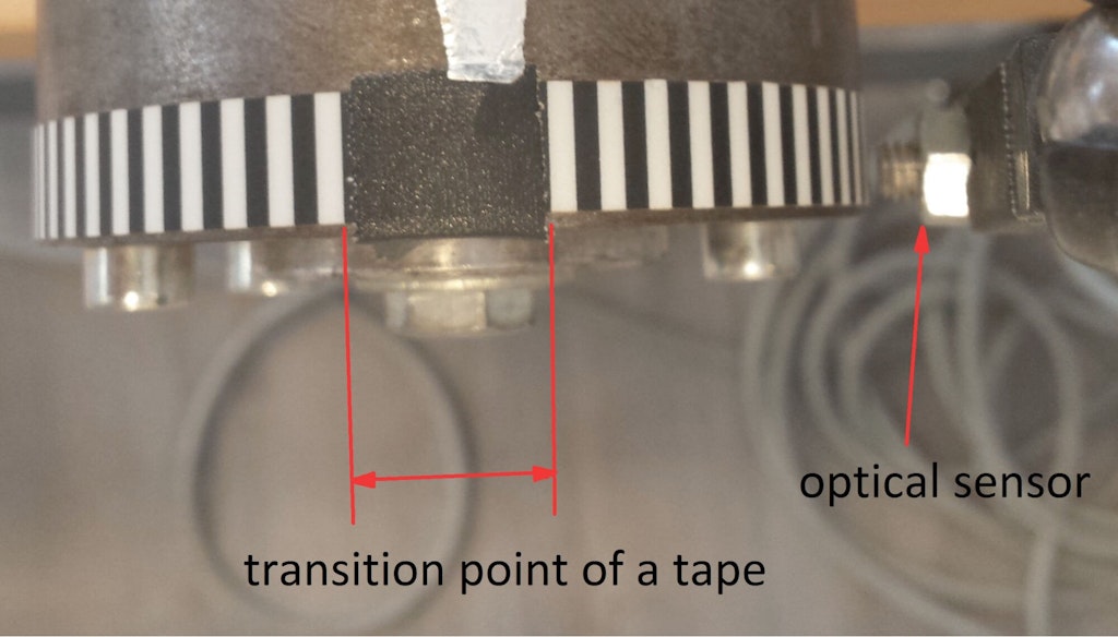 Triple black stripe serves as a zero reference point in a tape sensor
