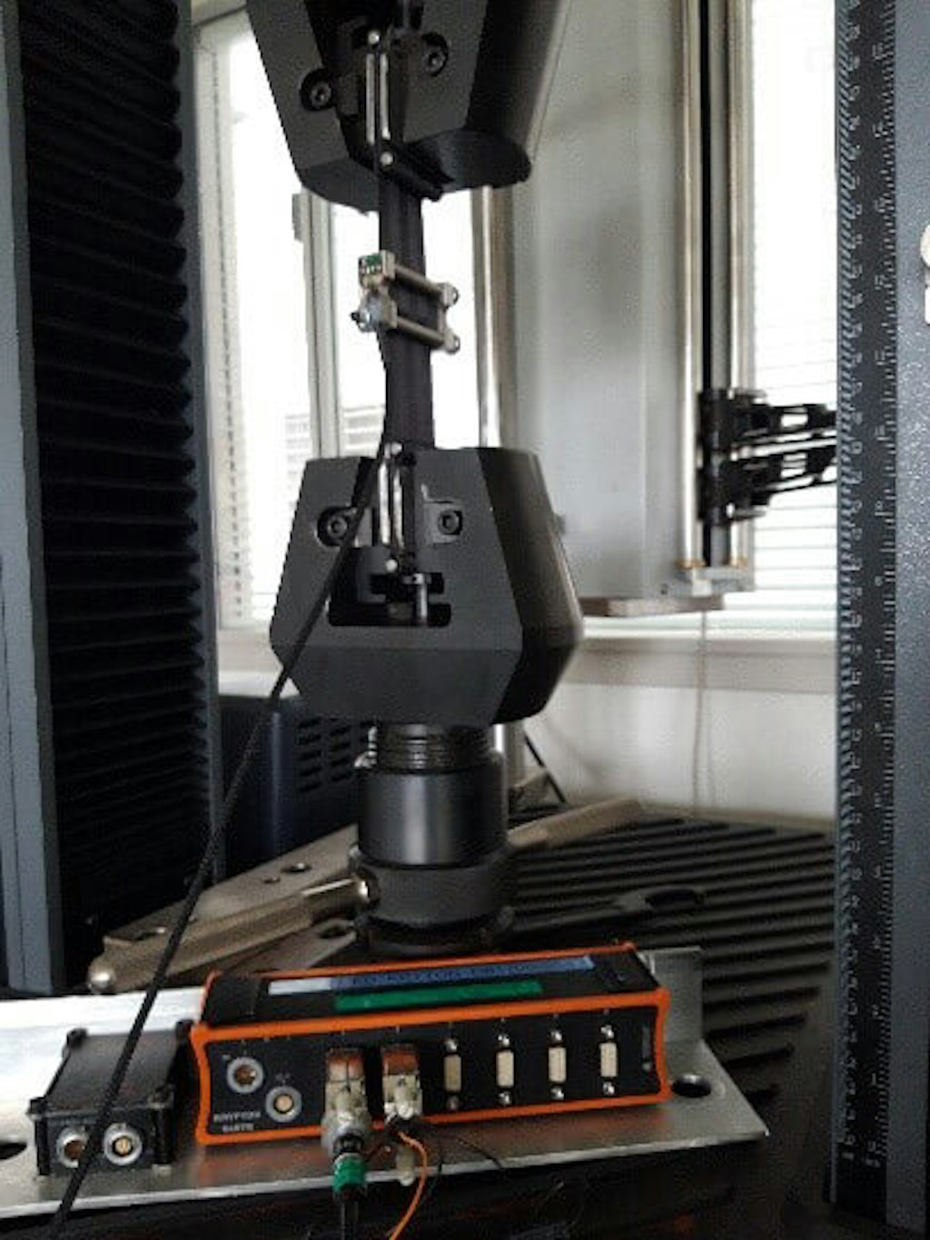 Fig. 14. A tension-compression machine with a known displacement setpoint is used to calibrate displacement sensors or strain gauges