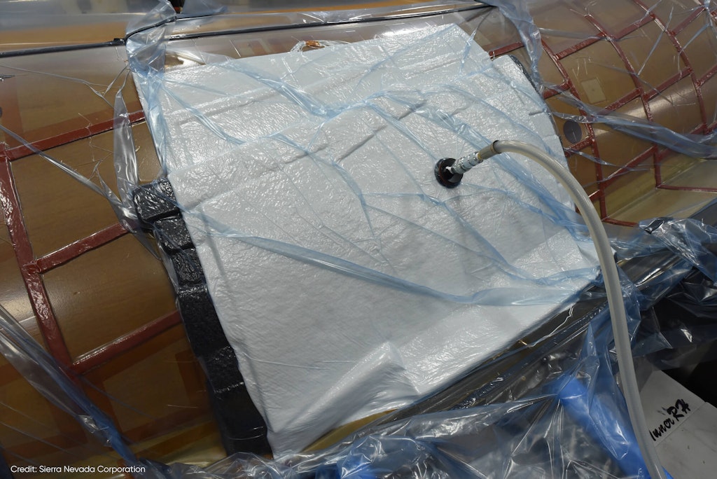 Figure 4. With the load cell attached to a vacuum chuck, a Bond Verification test is performed to check the adhesion of the tile to the structure.