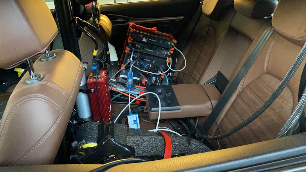Figure 6. Sirius slices with S-Box fixed on the rear seat by a custom made bracket. You can also see the IMU-GNSS device on its mounting strut.