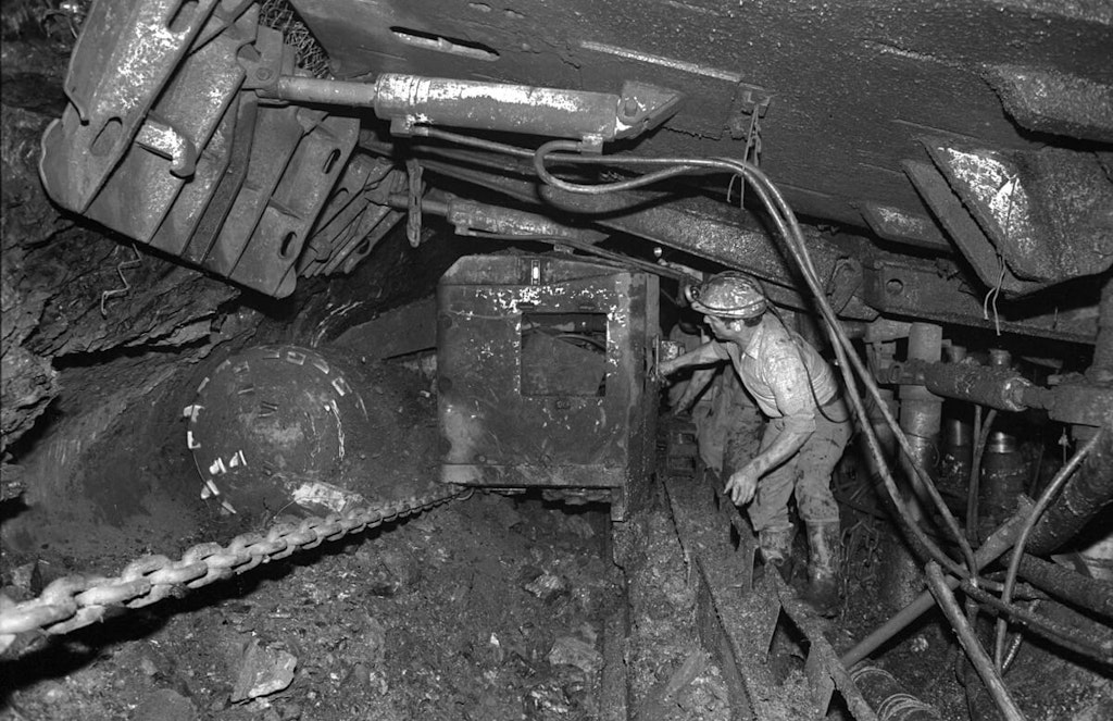 Operating a drilling machine inside the narrow mine tunnel