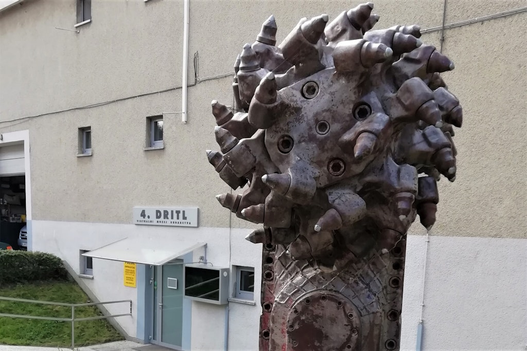 The drilling head of a tunnel boring machine in front of the 4. Drill mining museum in Trbovlje