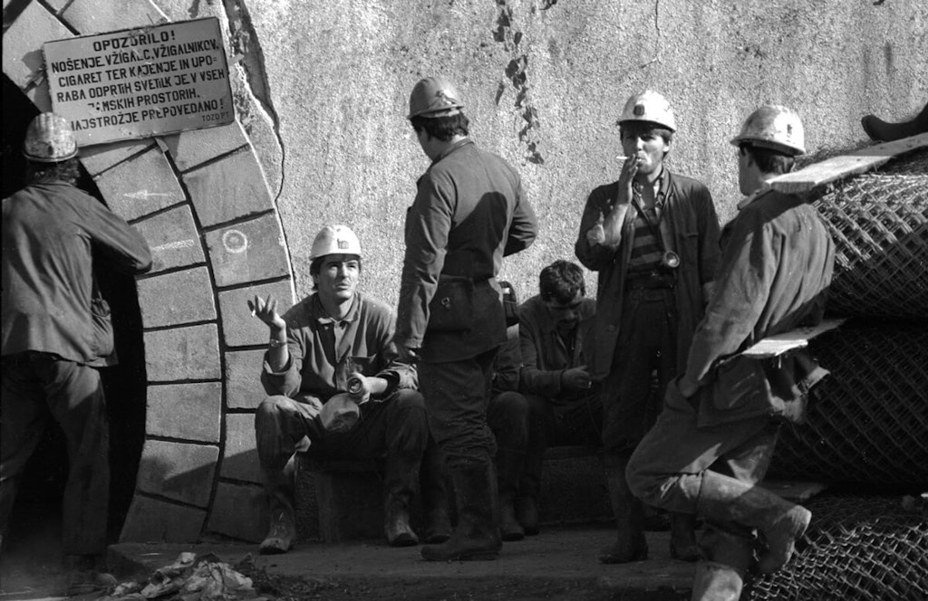 A smoke and some talk - knapsack kumrats enjoying a hard-earned break outside the mine