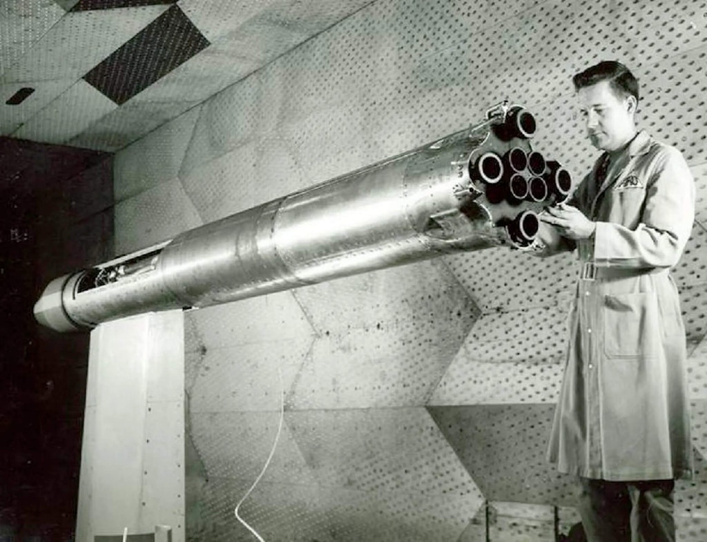 A 1/20 scale model of the Saturn launch vehicle is adjusted by D.W. Radford prior to testing in the 16-foot transonic wind tunnel at Arnold Air Force Base.