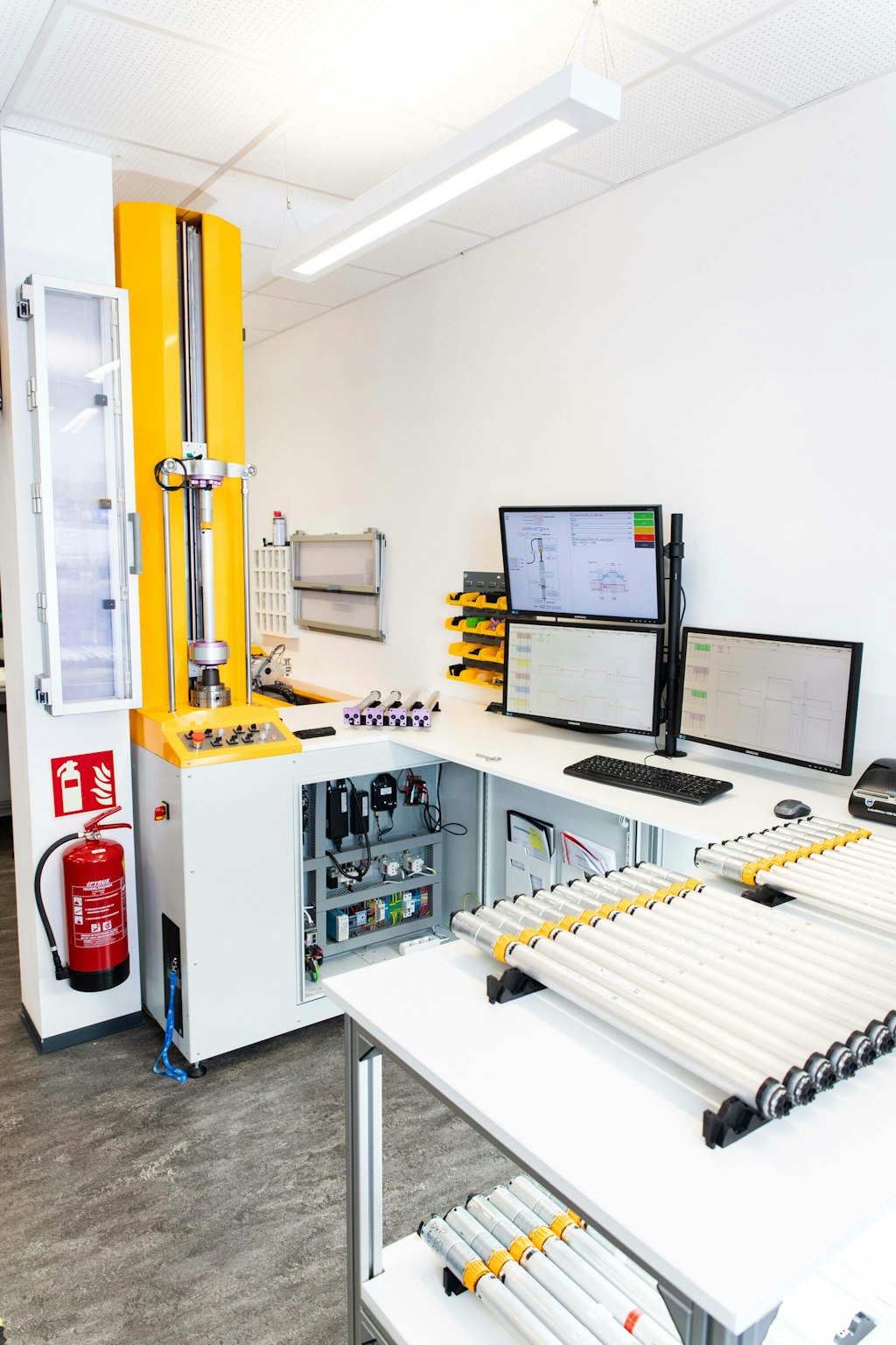 Figure 4. Analyzing the efficiency of the single components with the efficiency test bed - the DUT actuator mounted upright in the yellow section.