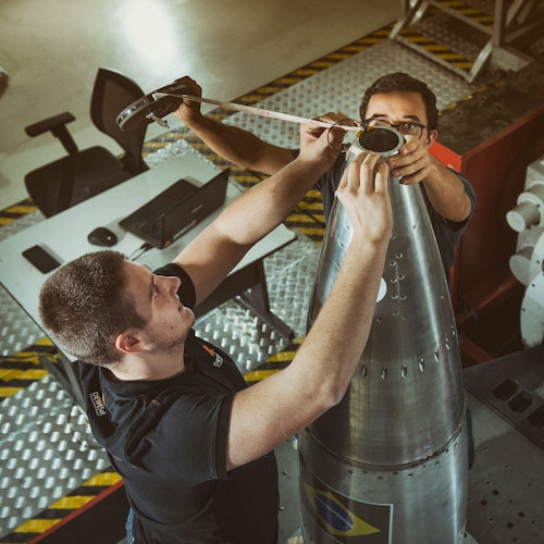 Dewesoft application engineers installing accelerometers on rocket cone