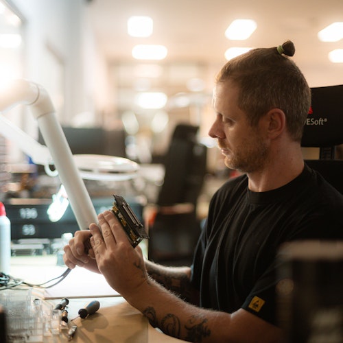 Dewesoft employee assembling the electronics inside production area