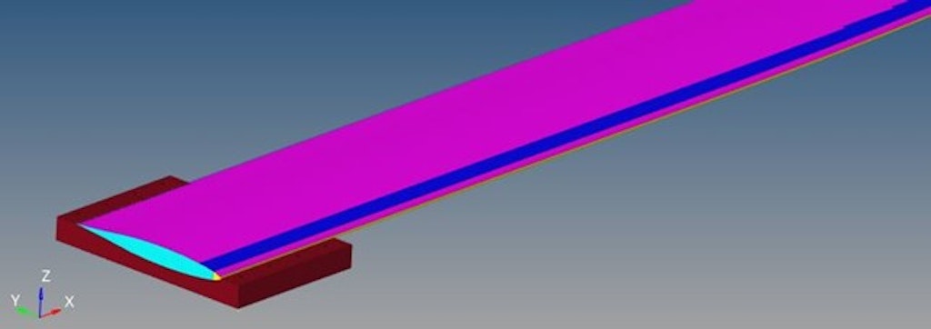 Figure 3. FE model: Half of the clamping system is in dark red. More materials compose the object of interest, each represented in a different color.