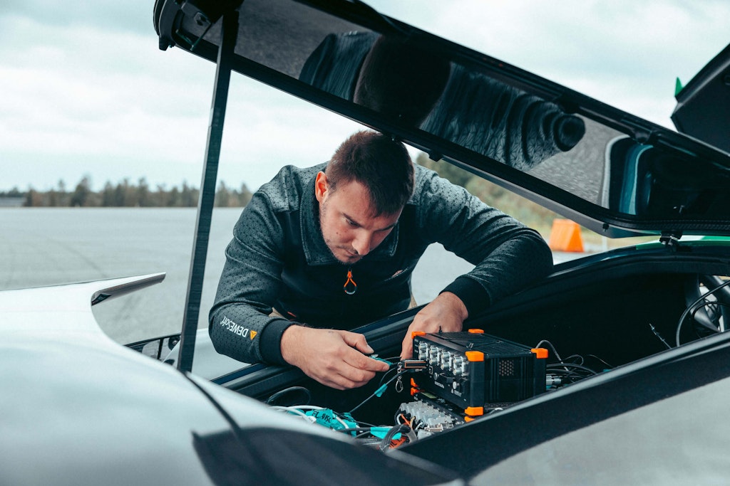 Matjaž  mounting Dewesoft equipment into Rimac Nevera