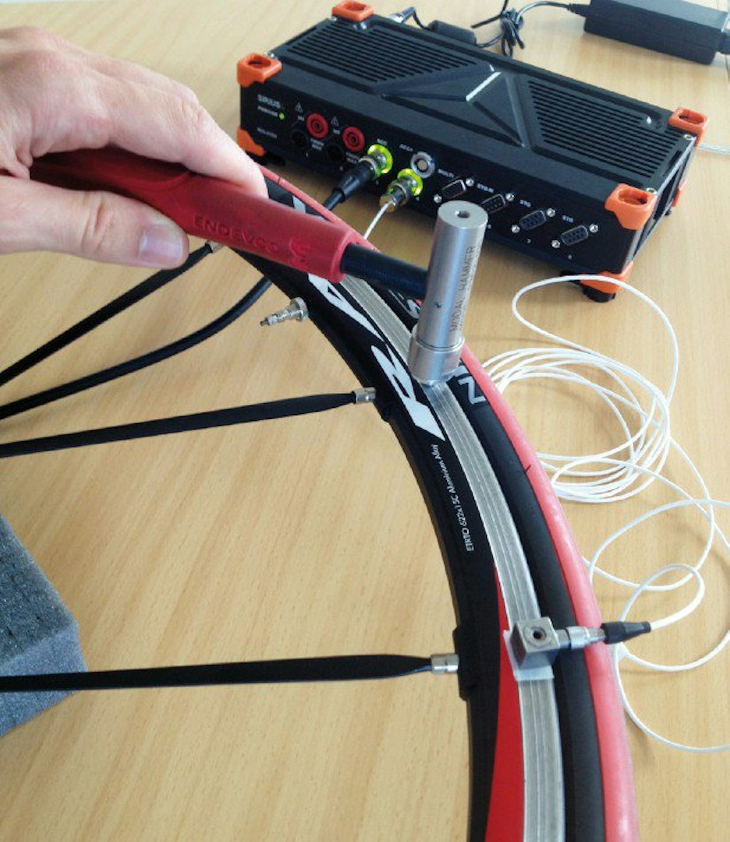 Exciting the structure with a modal hammer and measuring the response with an accelerometer