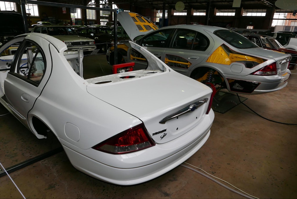 Several Ford cars after durability testing of body panels, seats and transoms OSX, Public domain, via Wikimedia Commons