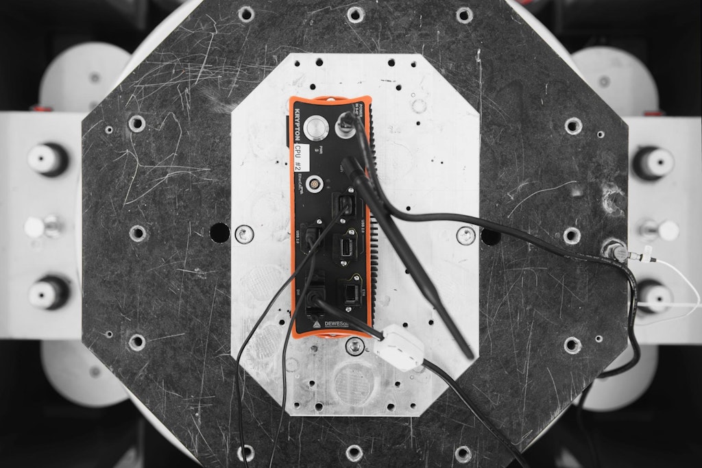 A Dewesoft KRYPTON DAQ module undergoes vibration testing on a shaker platform