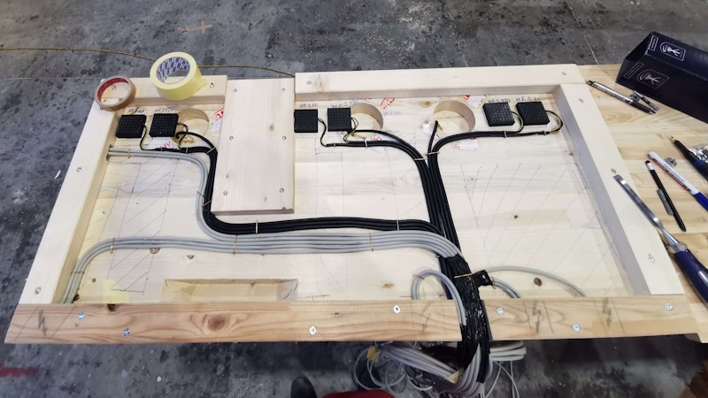 To the left is a strain gauge, and to the right are humidity sensors. Each humidity sensor measures the electrical impedance by two metal screws