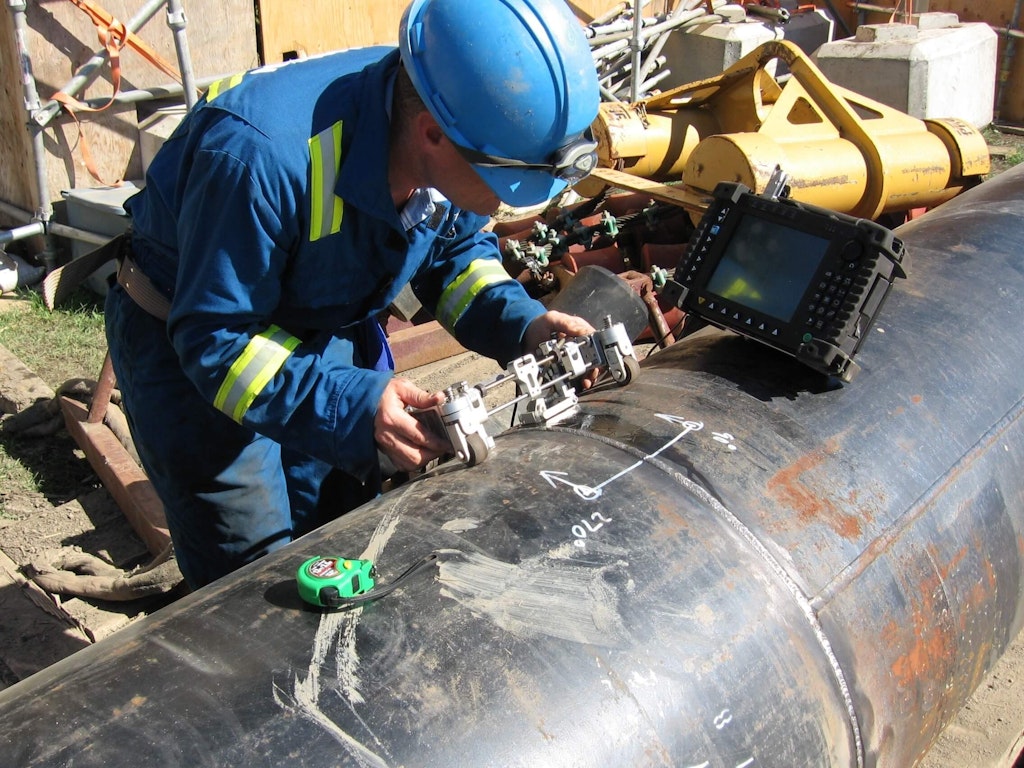 Testing a pipeline weld for defects using an ultrasonic phased array instrument. David Mack, Public domain, via Wikimedia Commons