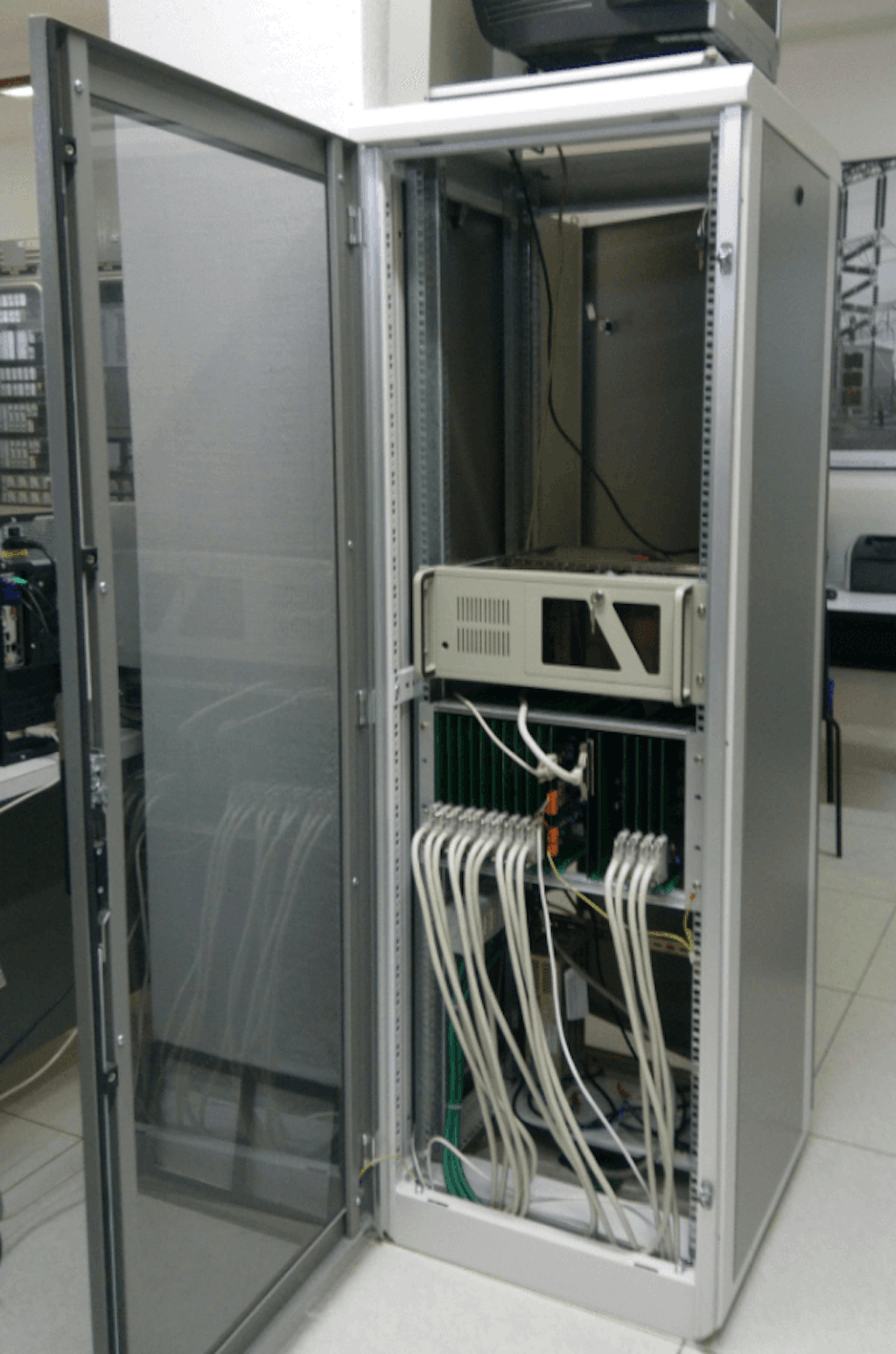 Figure 3. The old fault recording system’s rack with Altera boards connects to a DAQ board on a Linux PC.