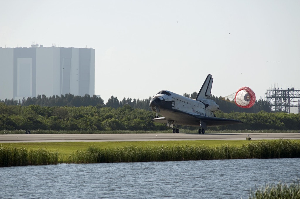 Following a mission to the International Space Station, orbiter Atlantis lands on Runway 33 at NASA's Kennedy Space Center in Florida. NASA/Sandra Joseph, Public domain, via Wikimedia Commons.