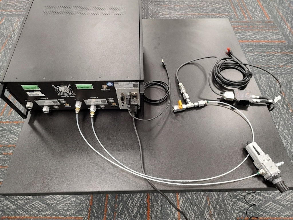 The air regulator and pressure transducer connected to the back of the Mensor pressure controller.