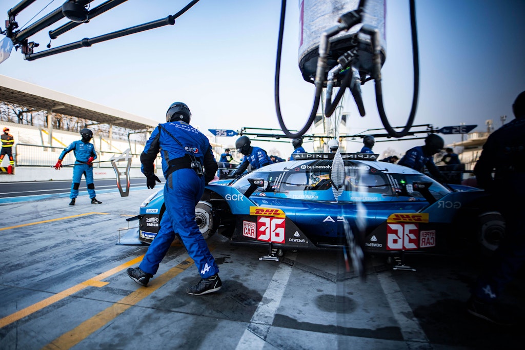 The Alpine crew works like a well-oiled machine to support their cars and drivers. Note the Dewesoft logo on the vehicle. 