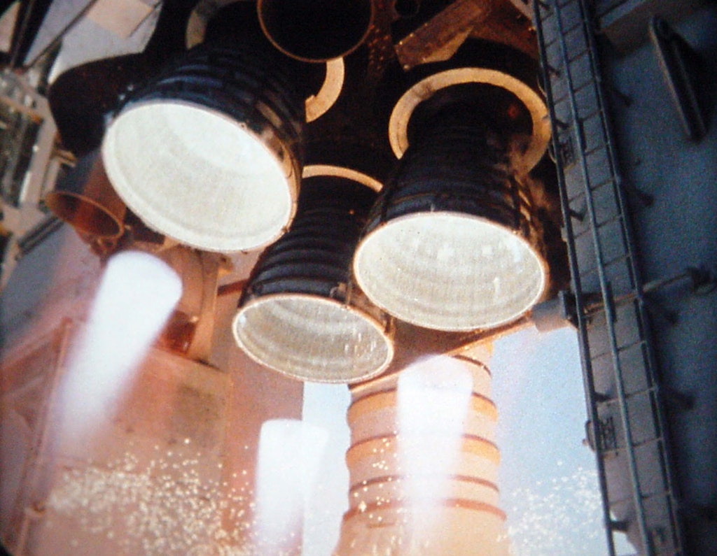Space Shuttle Atlantis's three Block II RS-25D main engines at liftoff during the launch of STS-110. Photo by NASA, public domain via Wikimedia Commons.