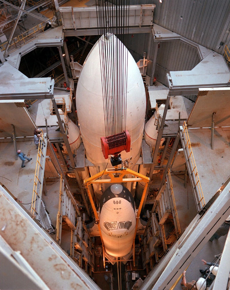 Enterprise mounted to the external fuel tank inside the Marshall Space Flight Center's Dynamic Test Stand. The tests were the first time a Space Shuttle assembly was vertically mated—photos by NASA. Enterprise mounted to the external fuel tank inside the Marshall Space Flight Center's Dynamic Test Stand. The tests were the first time a Space Shuttle assembly was vertically mated—photos by NASA.