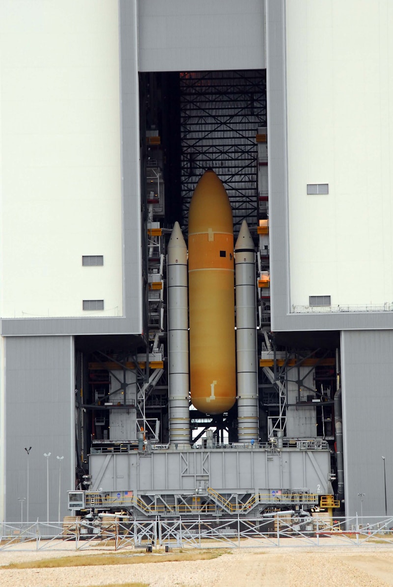 The high bay #1 doors of the Vehicle Assembly Building at NASA's Kennedy Space Center are open, revealing the Space Shuttle’s external fuel tank and solid rocket booster stack. The high bay #1 doors of the Vehicle Assembly Building at NASA's Kennedy Space Center are open, revealing the Space Shuttle’s external fuel tank and solid rocket booster stack.