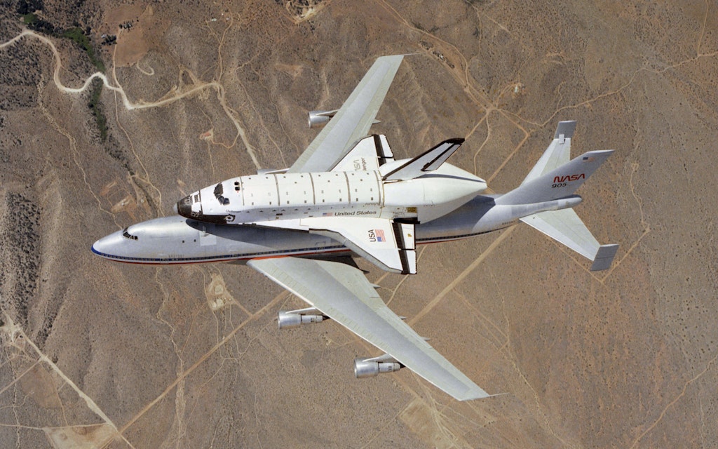 NASA’s 905 transport aircraft carries orbiter OV-099 after its Challenger refit to Houston, Texas—public domain photo by NASA.