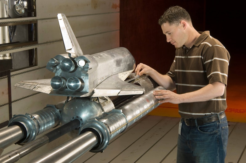 3% scale orbiter acoustics model in NASA Ames 11x11 foot transonic wind tunnel with Tim Steiger – photo by NASA. 3% scale orbiter acoustics model in NASA Ames 11x11 foot transonic wind tunnel with Tim Steiger – photo by NASA.