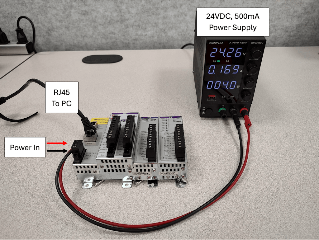 Figure 1-1. RMC75E Controller with Power and COM (Red: +VDC, Black: -VDC) setup