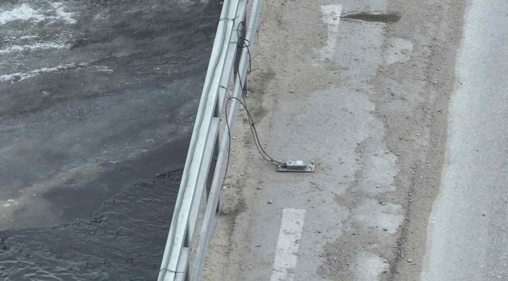  Figure 9. A close-up view of an accelerometer mounted on its plate, ready to capture the bridge's subtle movements.