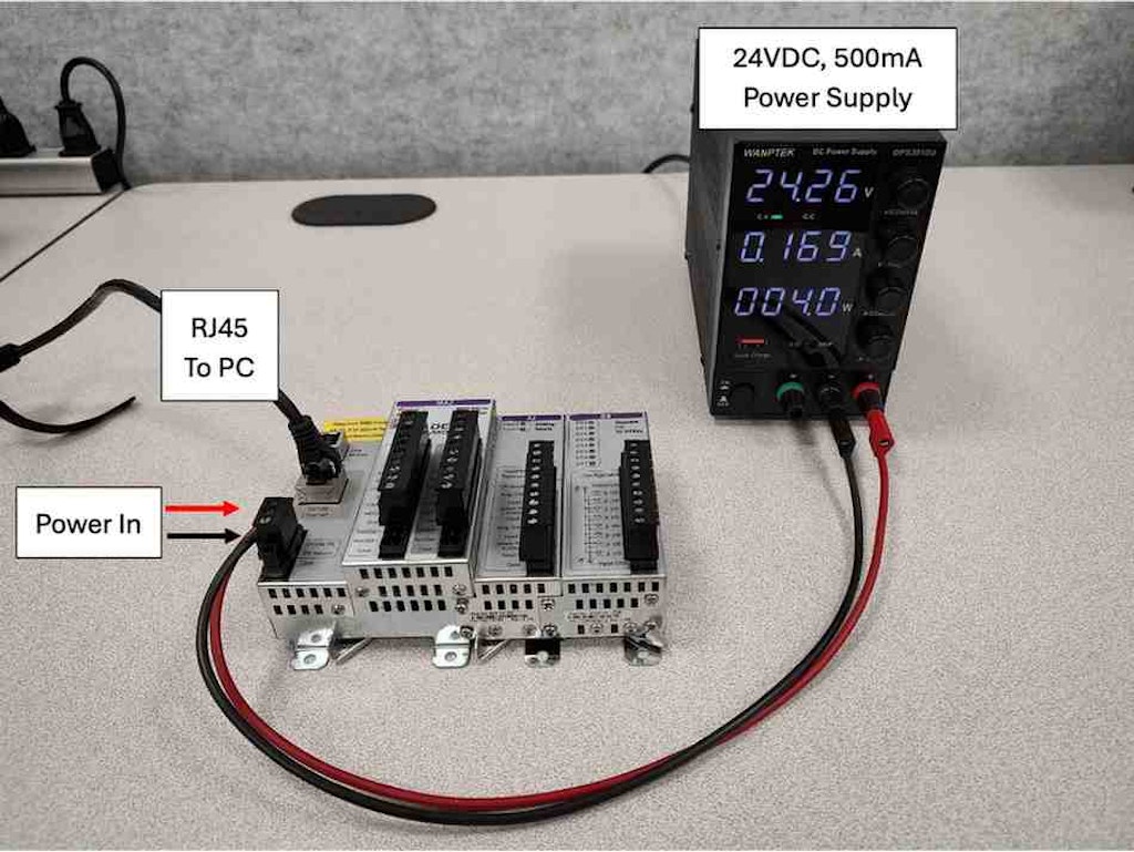 Figure 1-1. RMC75E Controller with Power and COM (Red: +VDC, Black: -VDC) setup