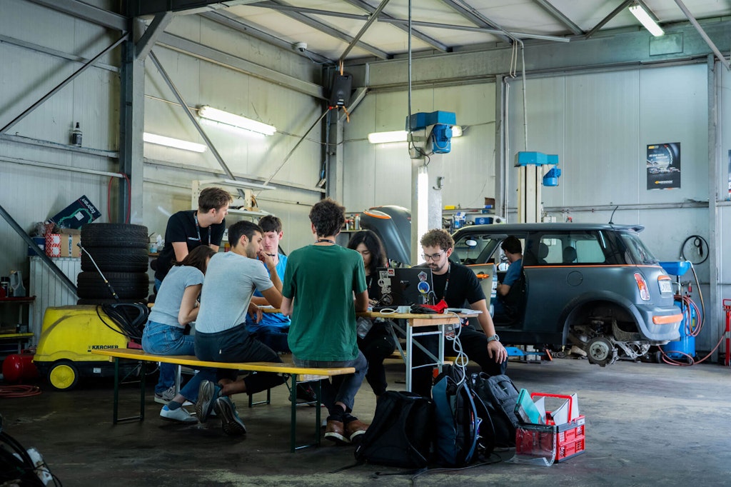 The garages offered more than space, they became places of guidance and teamwork