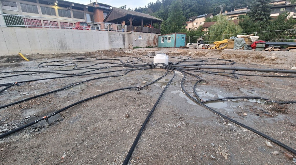 Top: Borehole field of the designed BTES system during construction.