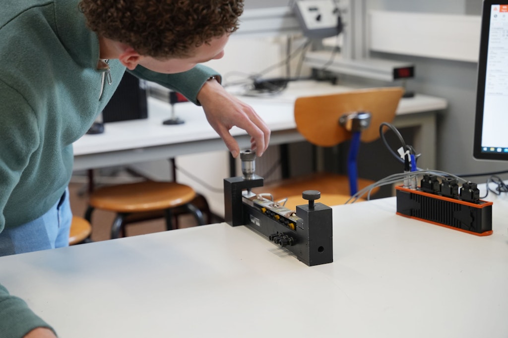 The setup for strain measurements to validate beam theory results.