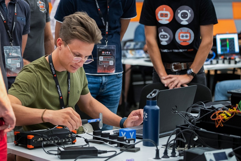 Klemen Semelbauer, Dewesoft Student Ambassador, performing a modal analysis test with an impact hammer and DAQ hardware at the Dewesoft Summer Camp 2024