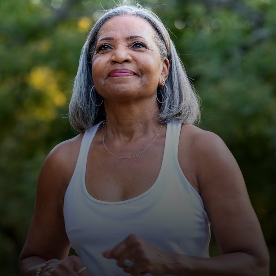 Older woman running outside