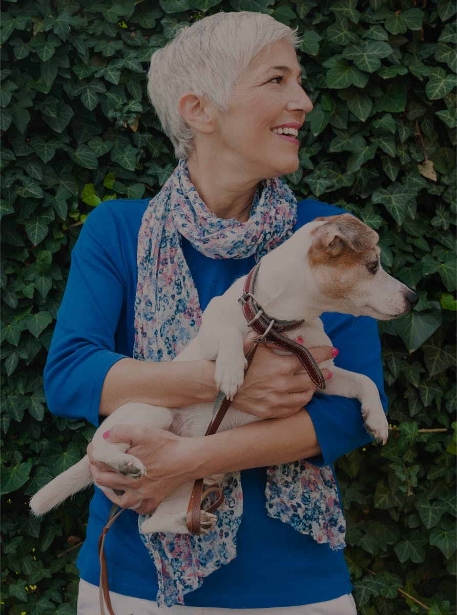 Woman holding a puppy