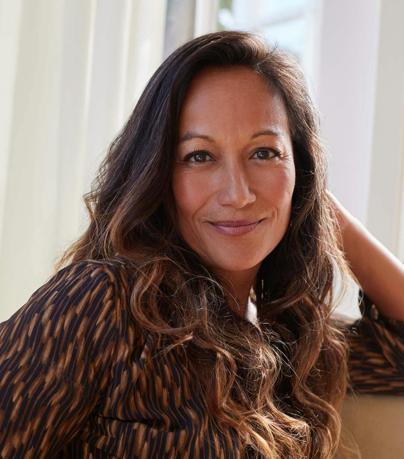Woman Posing in Front of a Window